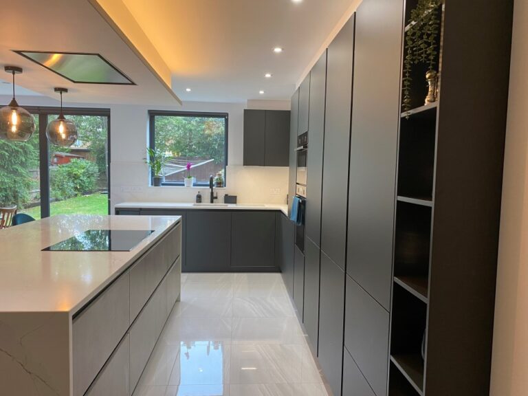 Kitchen with lava black tall units and concrete effect island units
